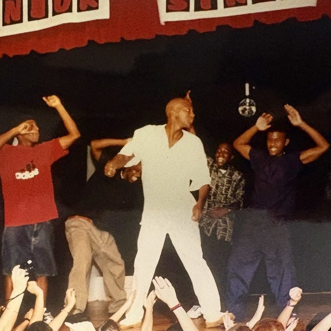BKHS classmate dancing on stage during a senior week event, 1996